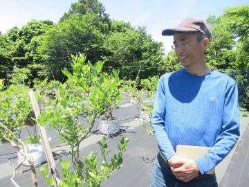説明する佐々木代表