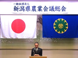 北陸農政局長祝辞を代読する田口地方参事官